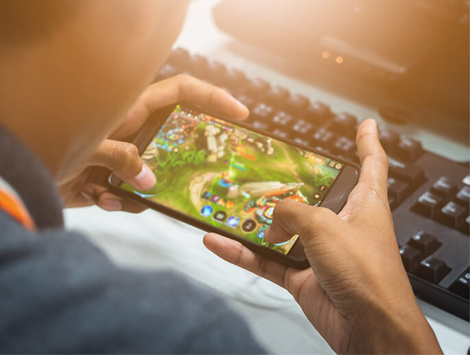 Person playing a game on their mobile phone.